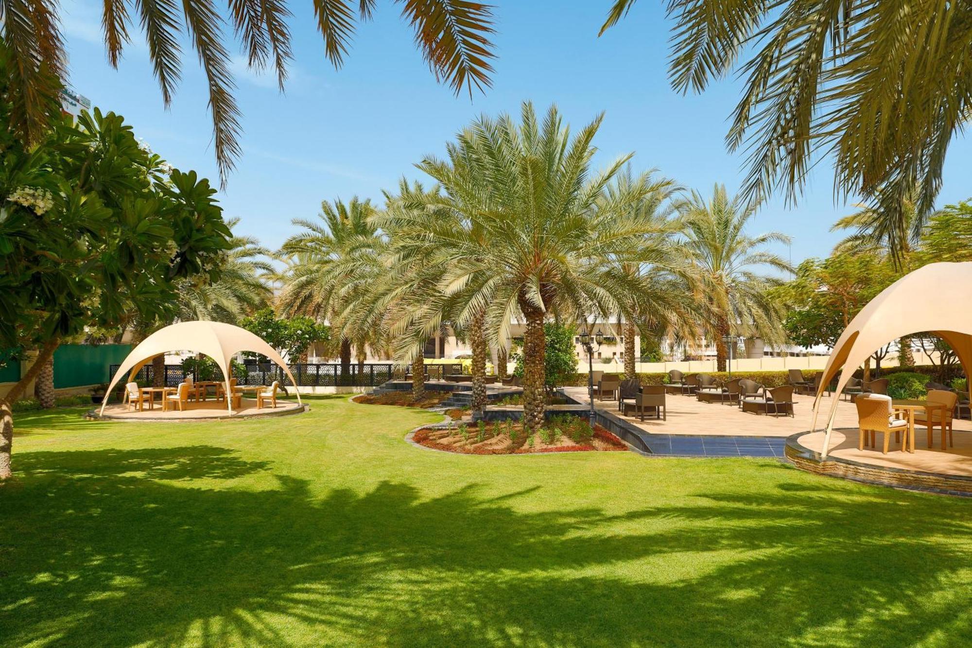 Sheraton Oman Hotel Muscat Exterior foto The resort's gardens